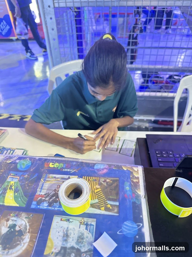 Person signing cards at a table