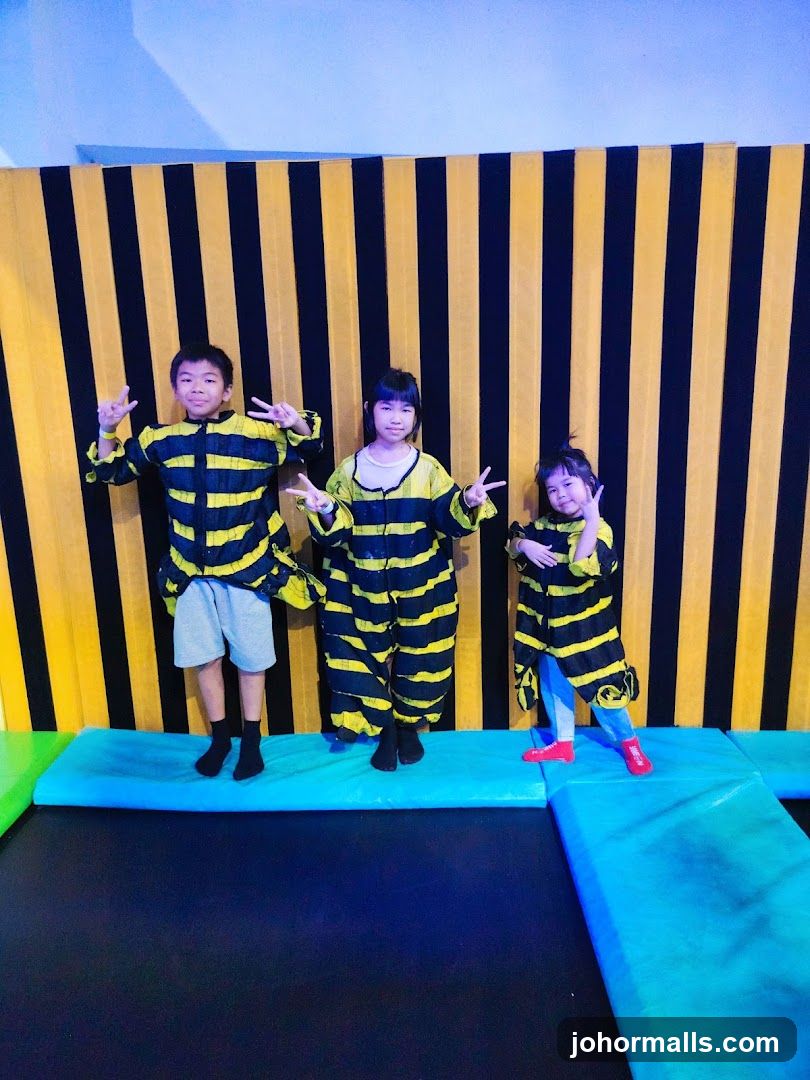 Children in Bee Costumes on Trampoline