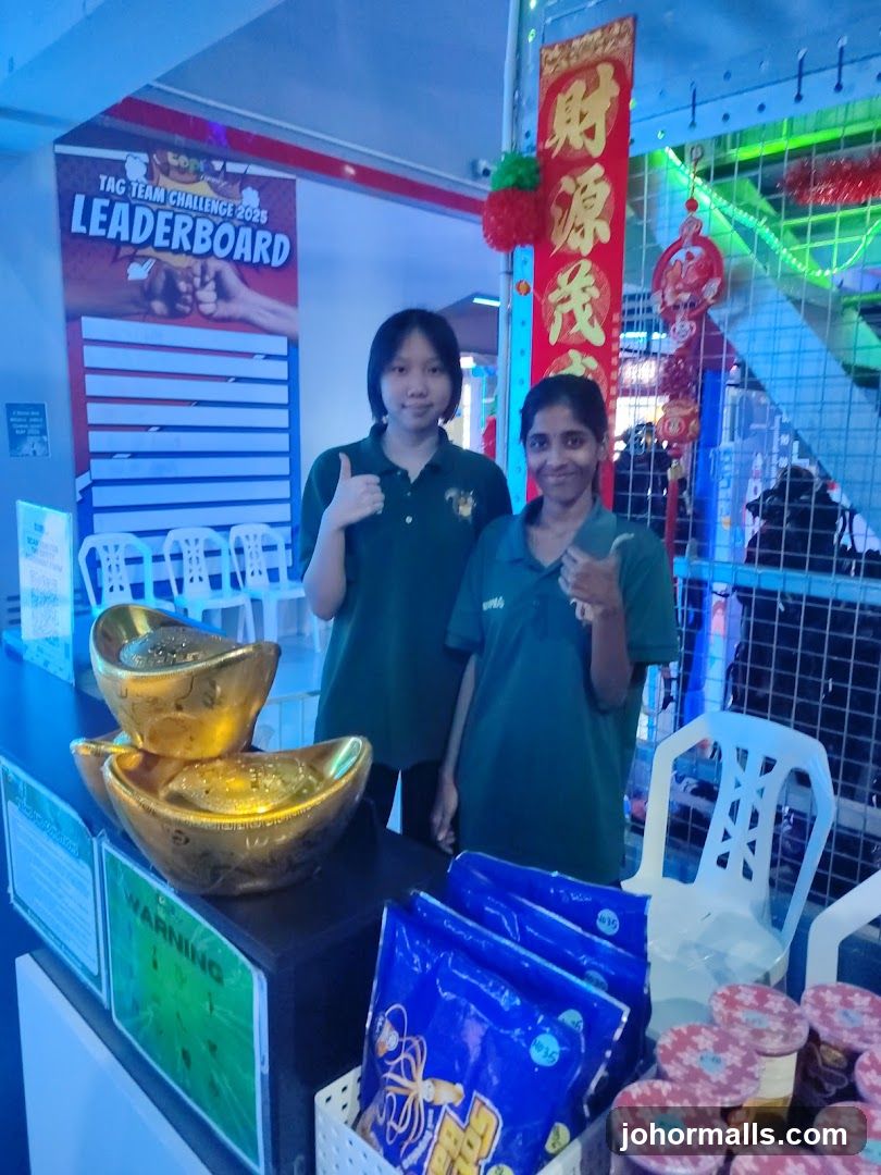 Two employees giving thumbs up