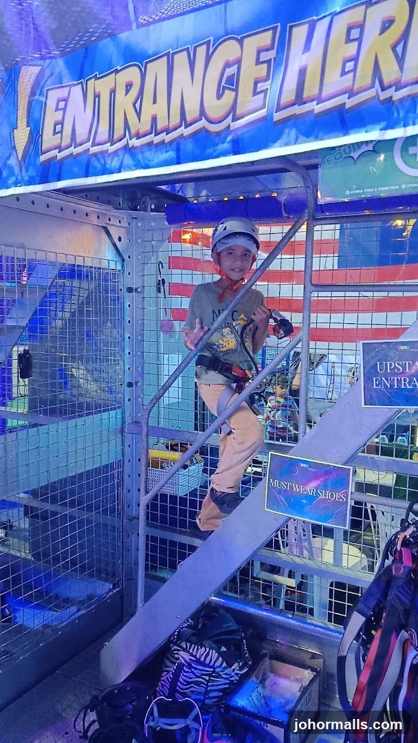 Boy on stairs at adventure park