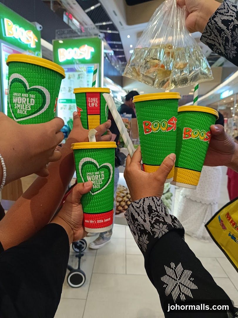 People holding Boost cups