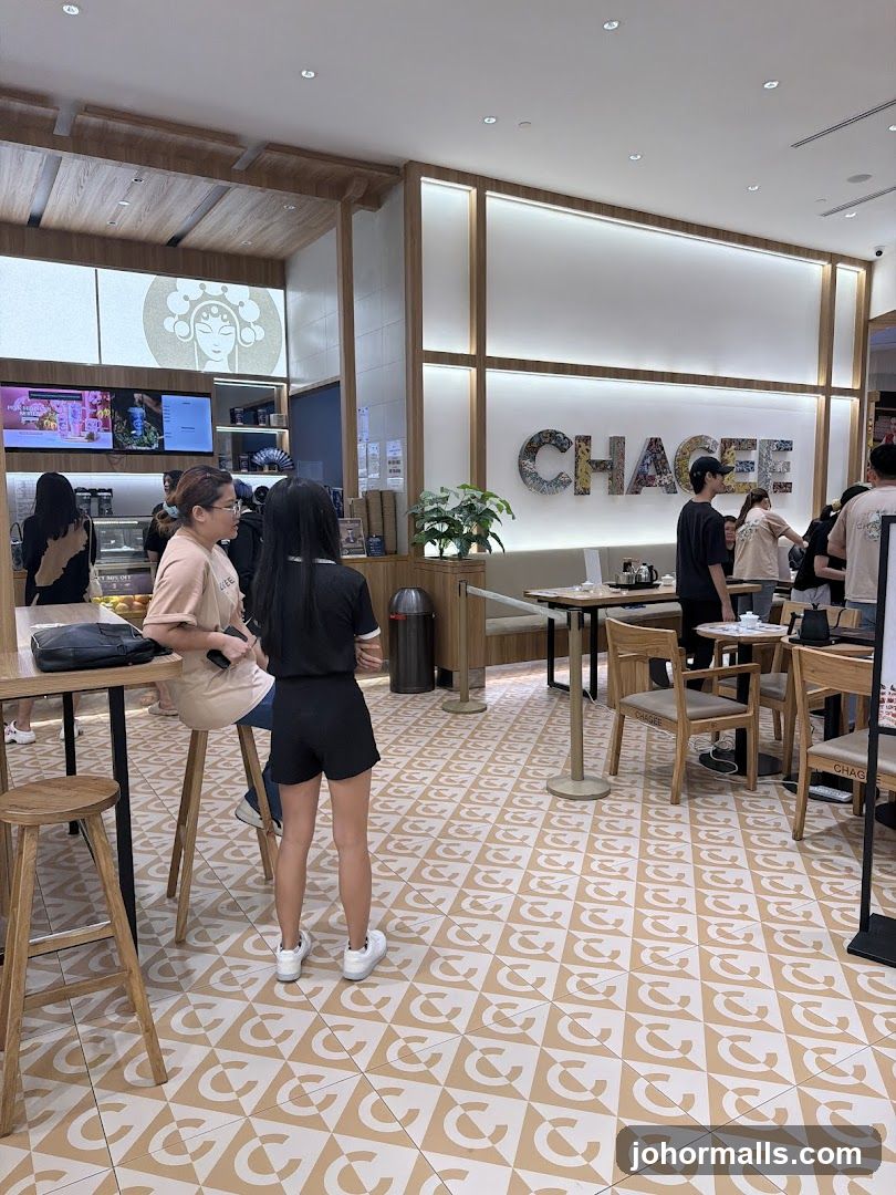 Interior of a cafe with seating and signage