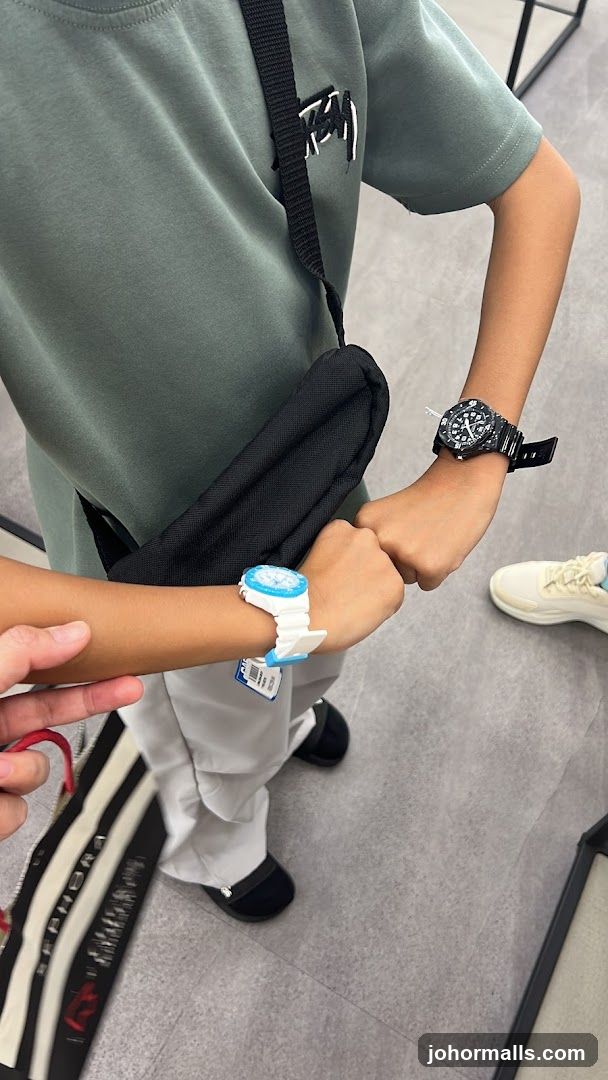 Two people showing off watches