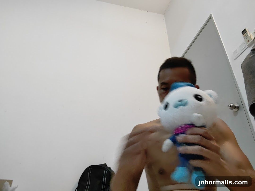 Man holding a plush toy