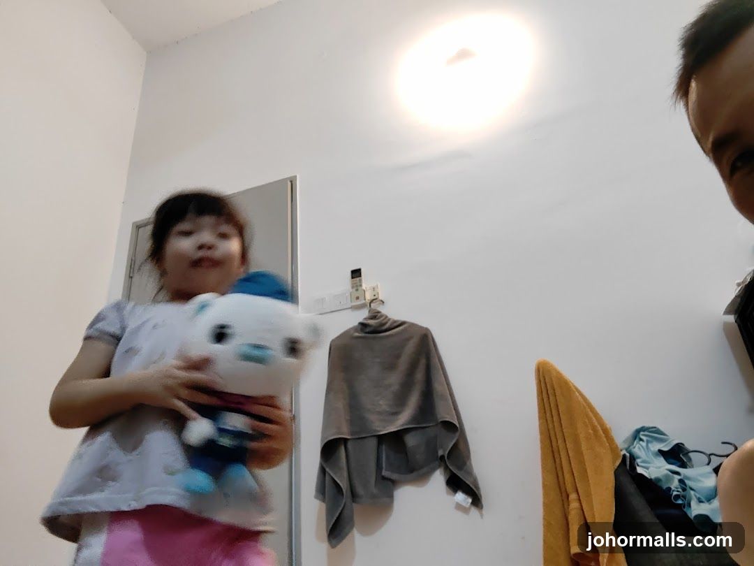 Girl holding a stuffed toy