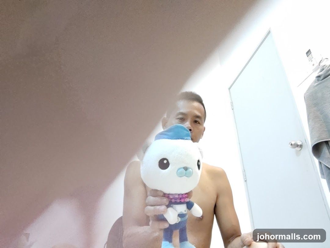 Man holding a stuffed toy