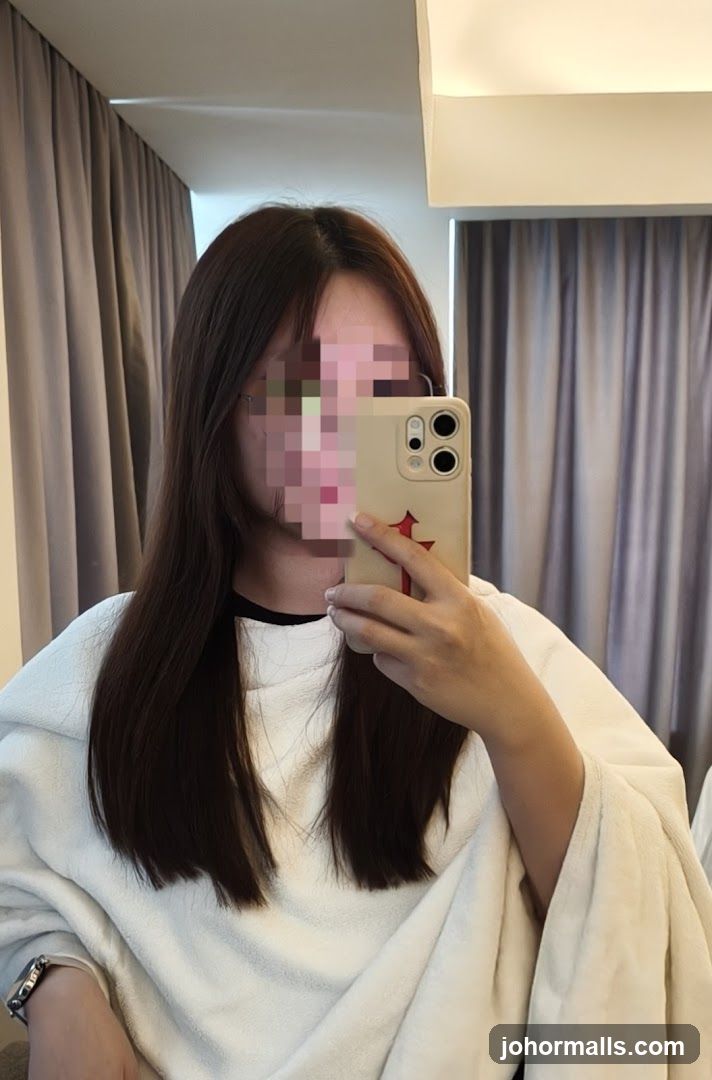 Woman taking a mirror selfie
