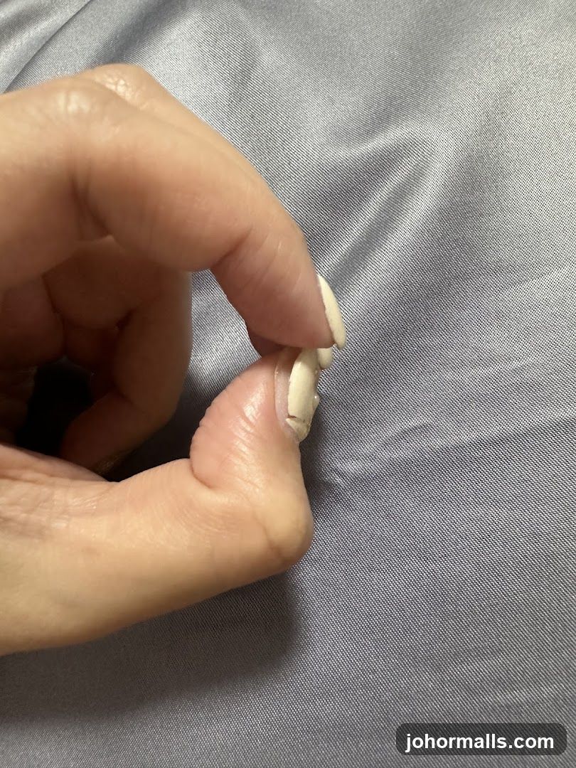 Close-up of a hand pinching fabric