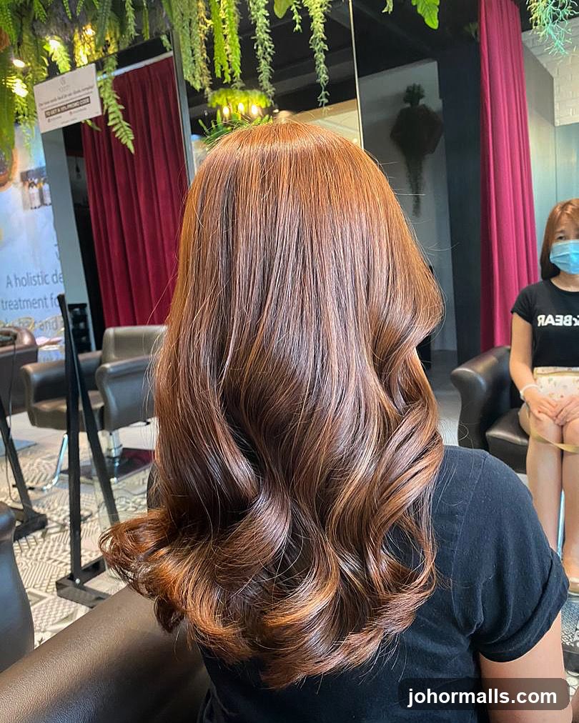 Woman with styled auburn hair