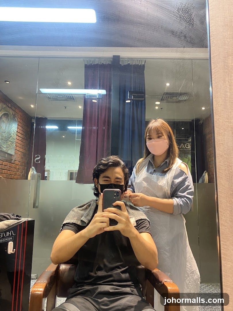 Man taking a selfie in a salon