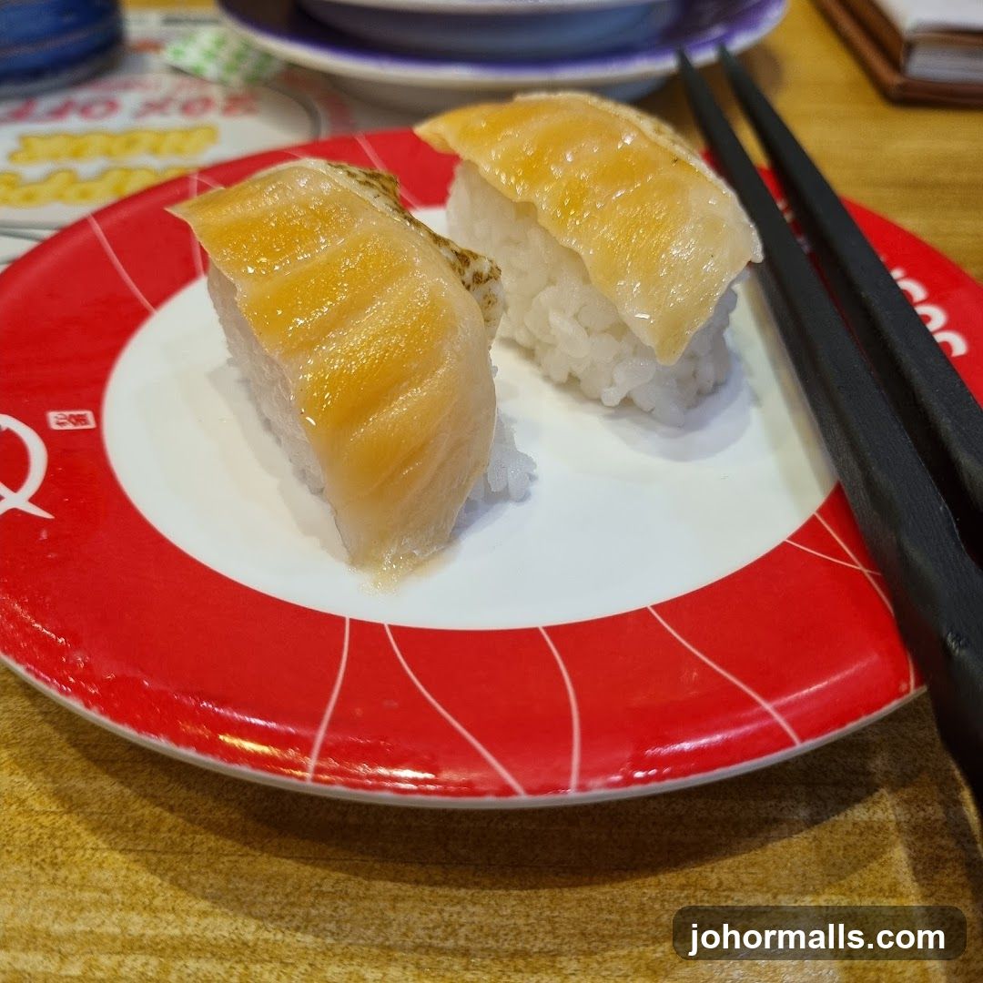 Two pieces of sushi on a plate