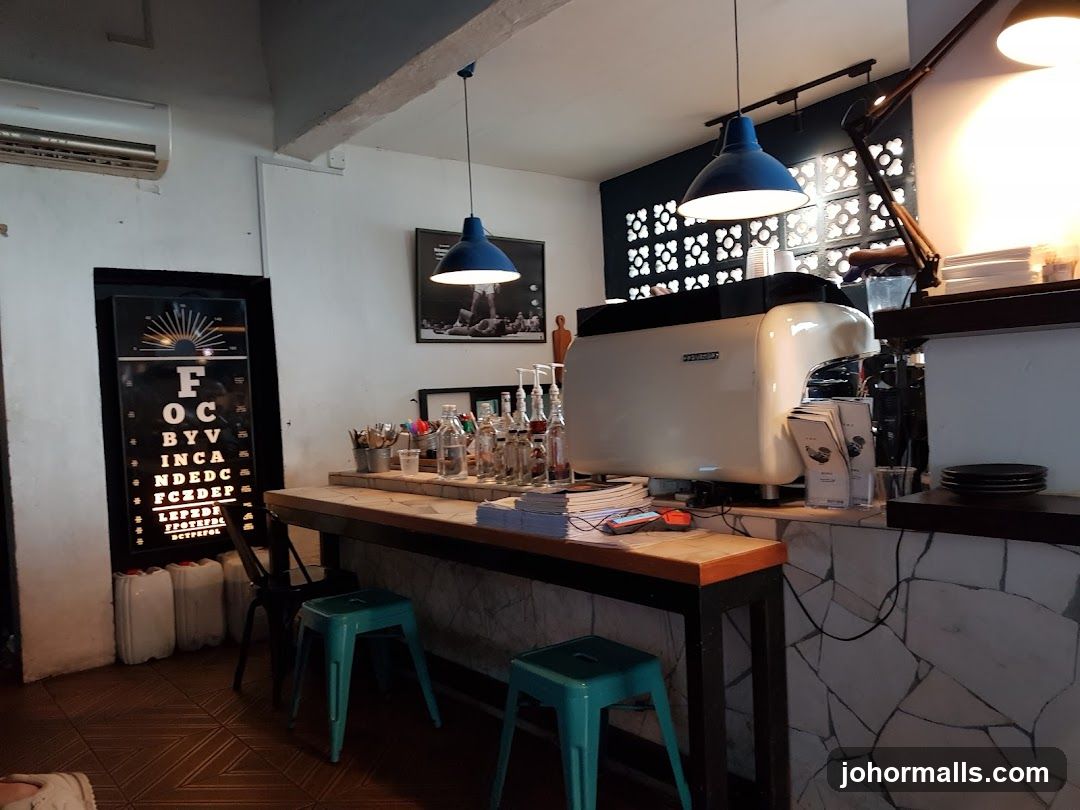 Coffee shop interior with espresso machine and eye chart decor