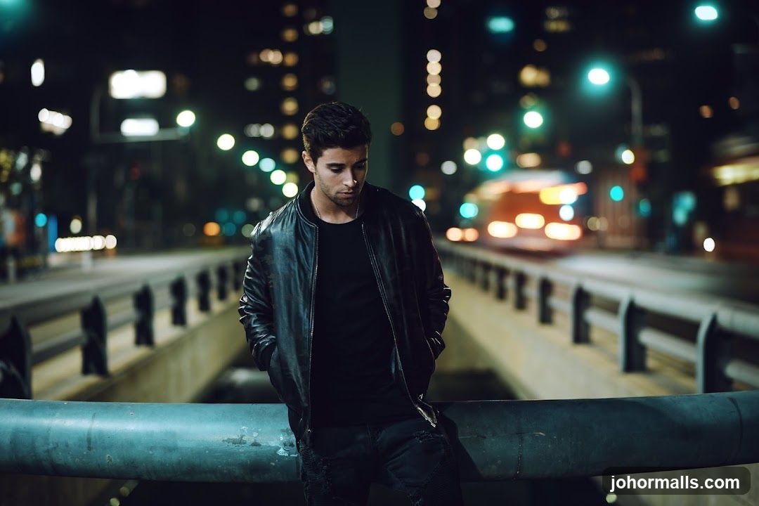 Man in Leather Jacket at Night