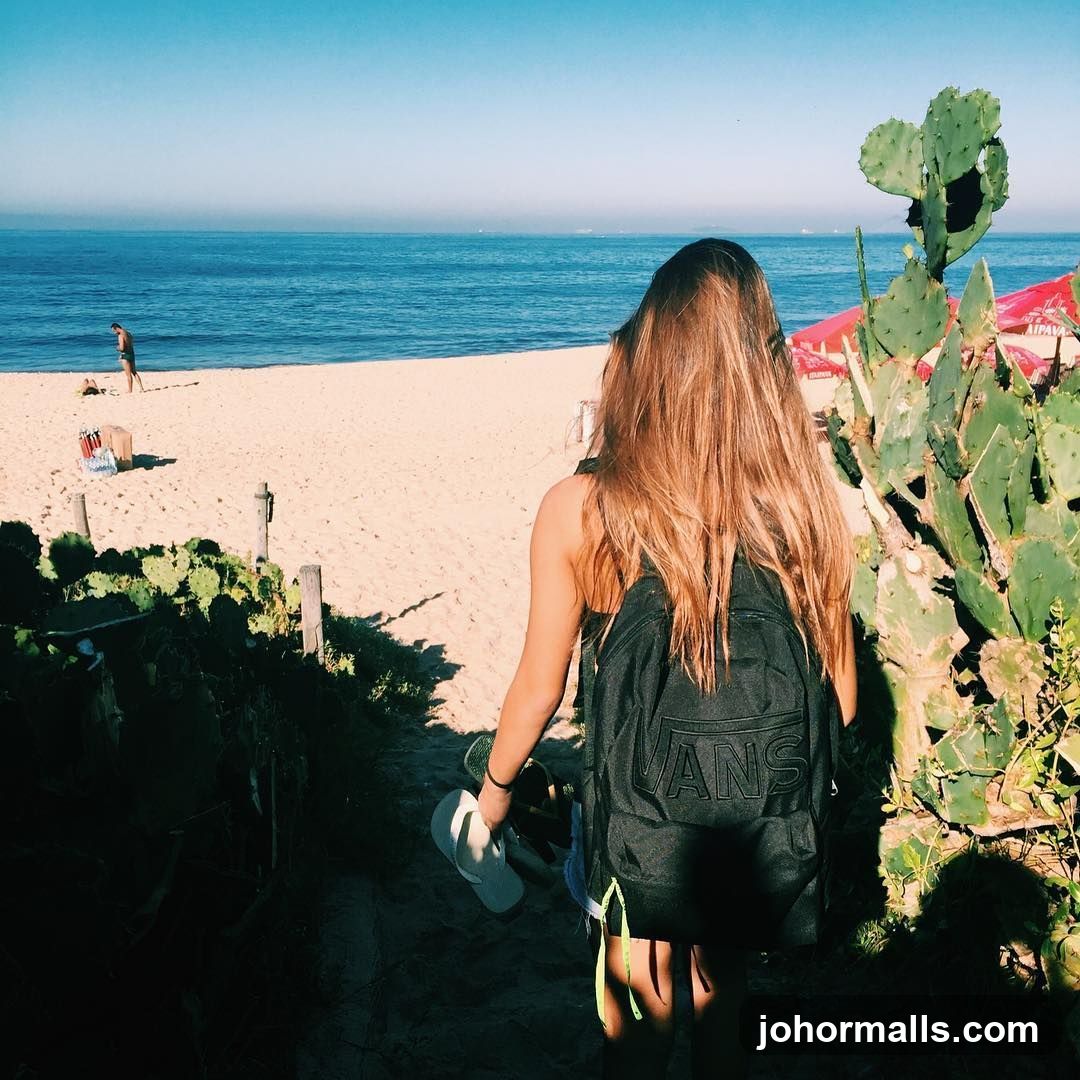 Woman walking towards the beach