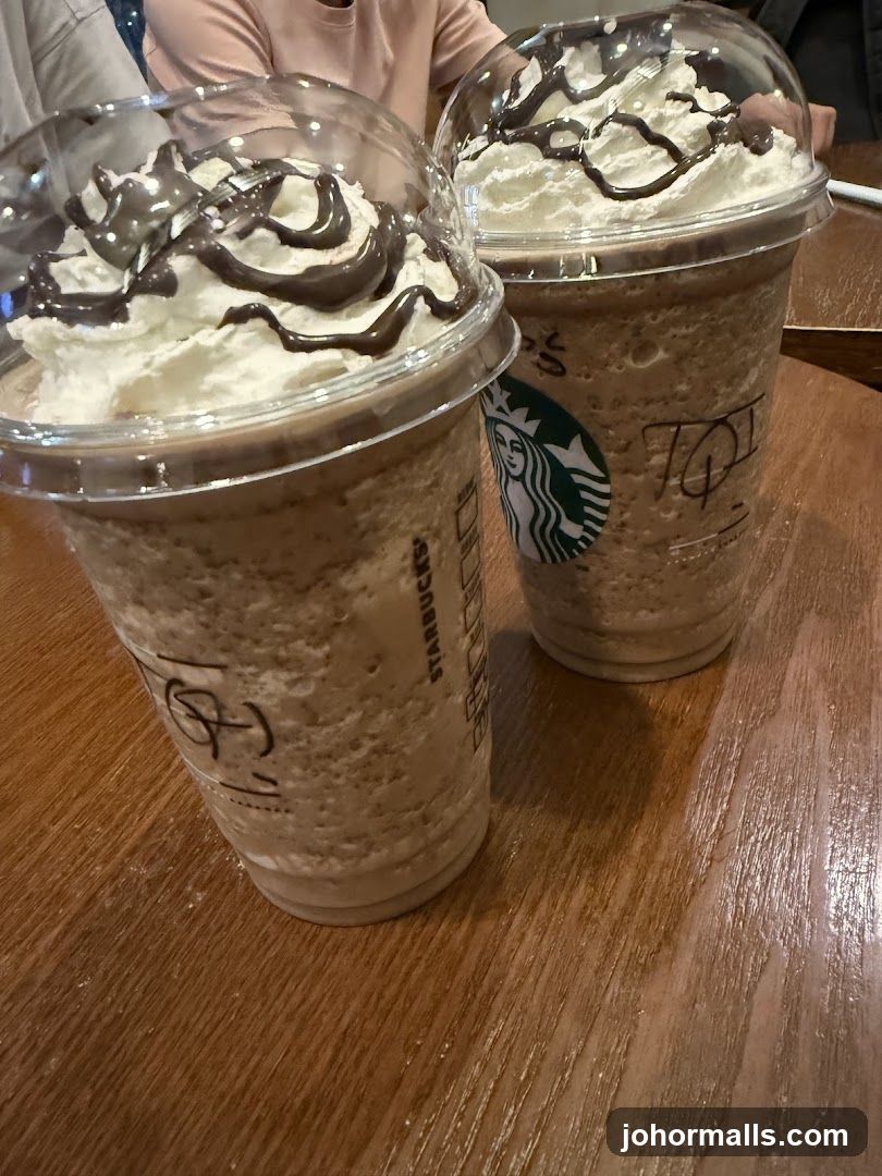 Two Frappuccinos with Whipped Cream and Chocolate Drizzle