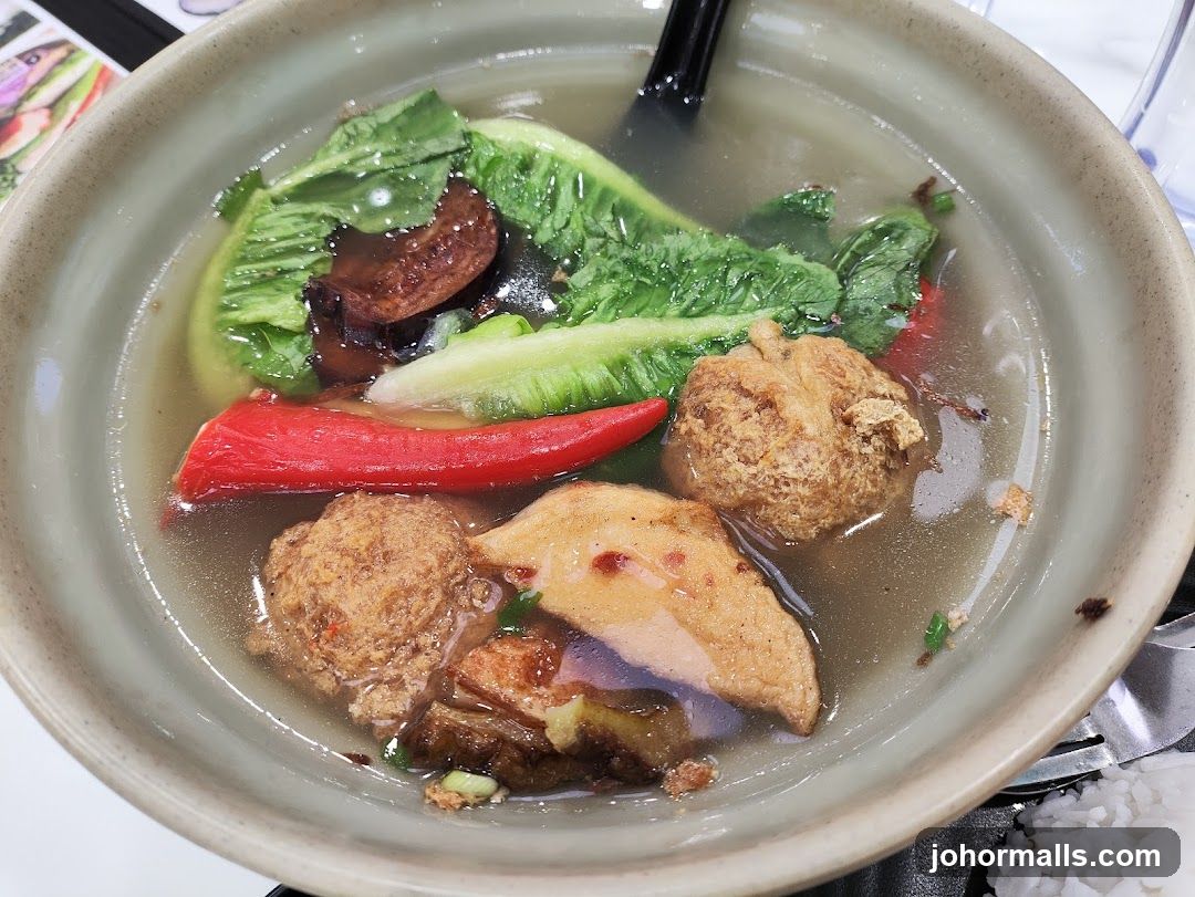 Bowl of Soup with Meatballs and Vegetables