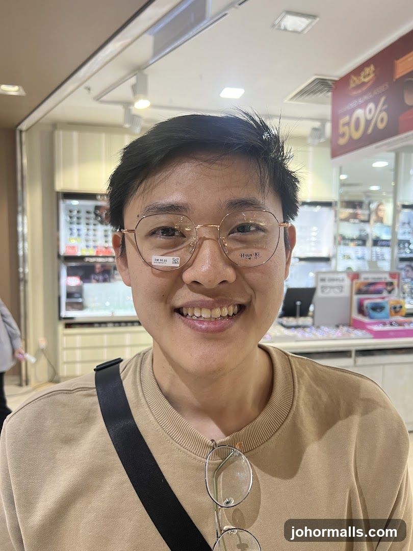 Person wearing glasses in an optical shop