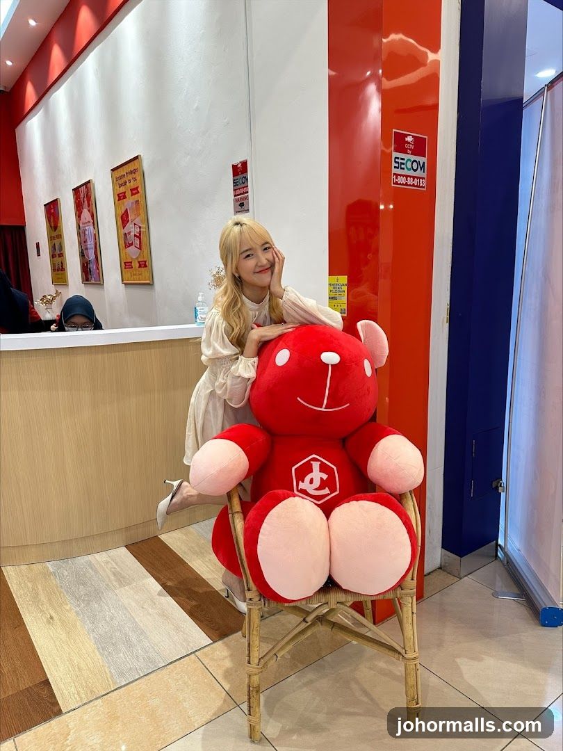 Woman Poses with Large Teddy Bear