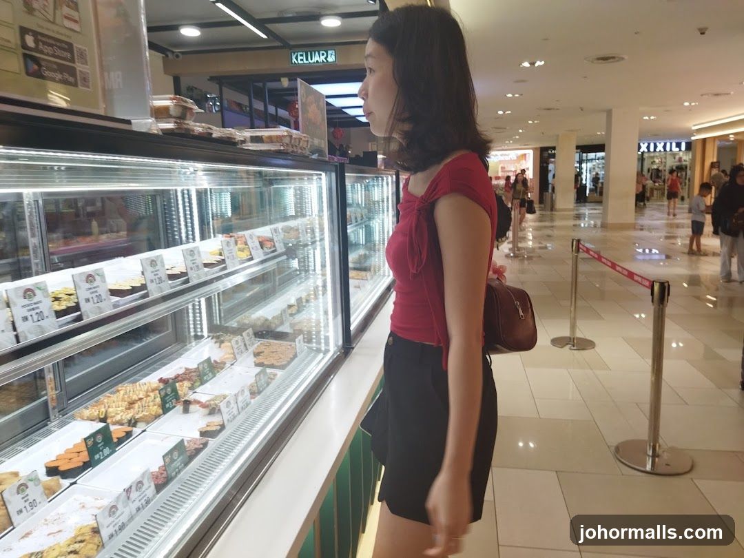 Woman looking at food display
