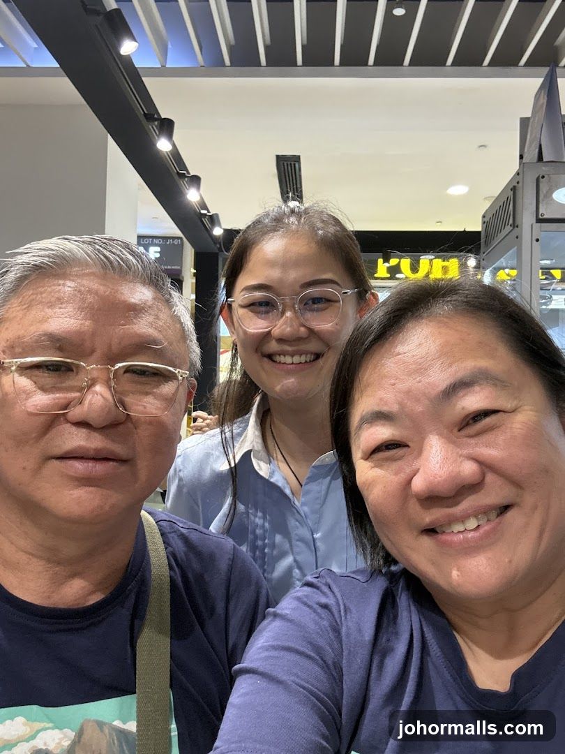 Three people smiling for a selfie