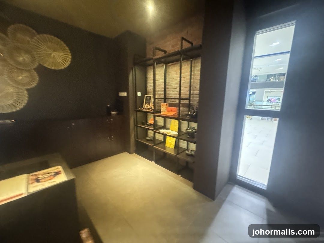 Interior of a shop with display shelves and a window