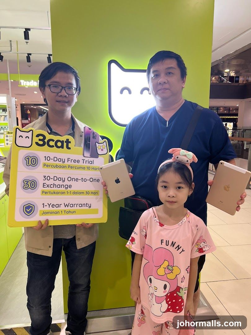 Family Posing with iPads and Promotional Sign
