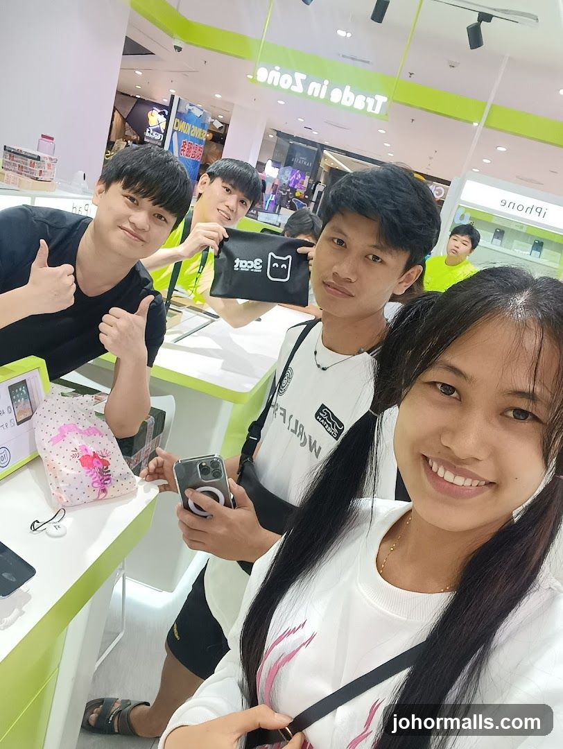 Group Posing in Electronics Store