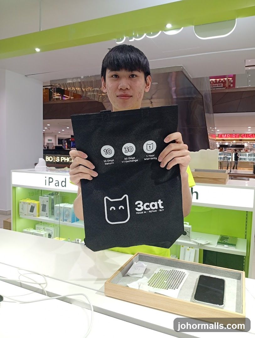 Man holding a branded bag