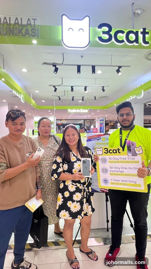 People with phones and promotional sign