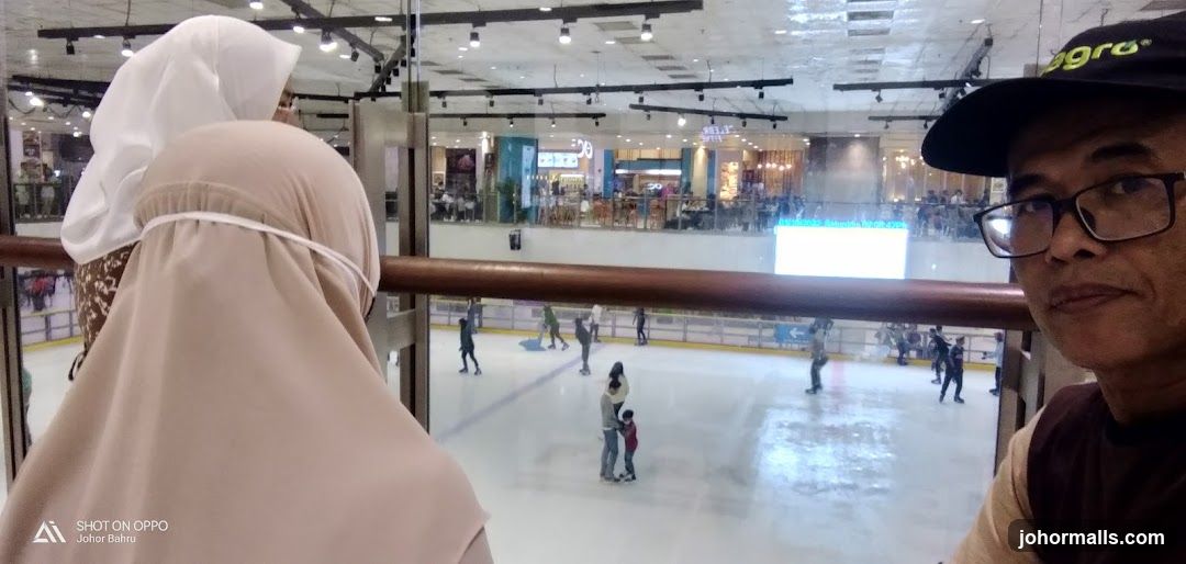 People ice skating in a mall