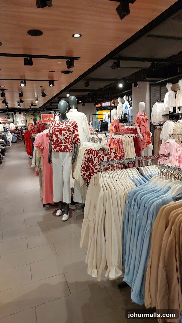 Clothing store interior with mannequins and apparel