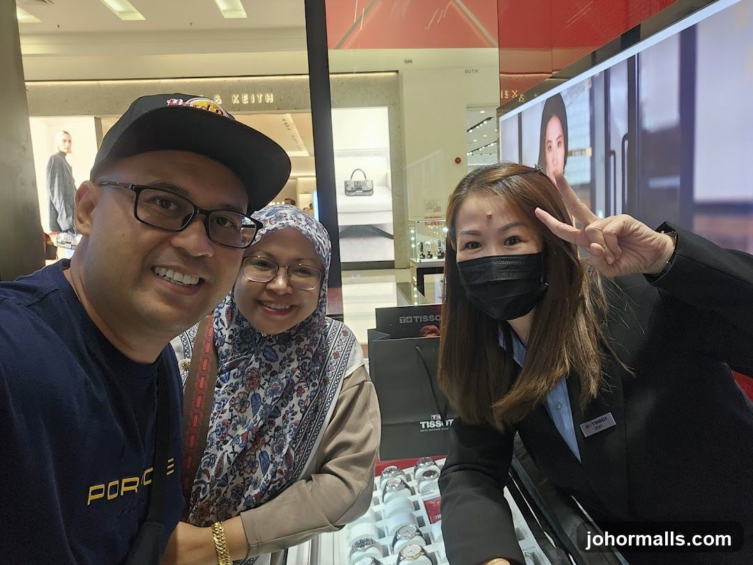 People posing for a selfie in a watch store