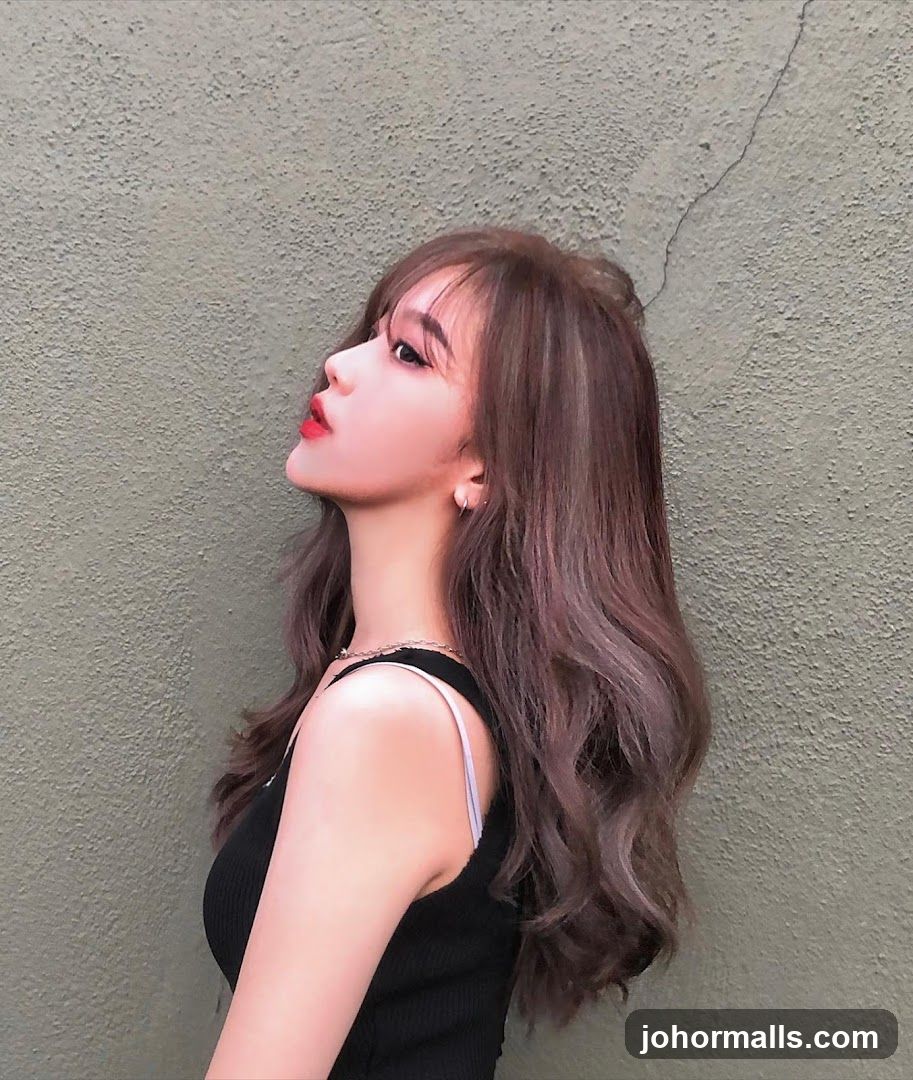 Woman Posing Against Textured Wall