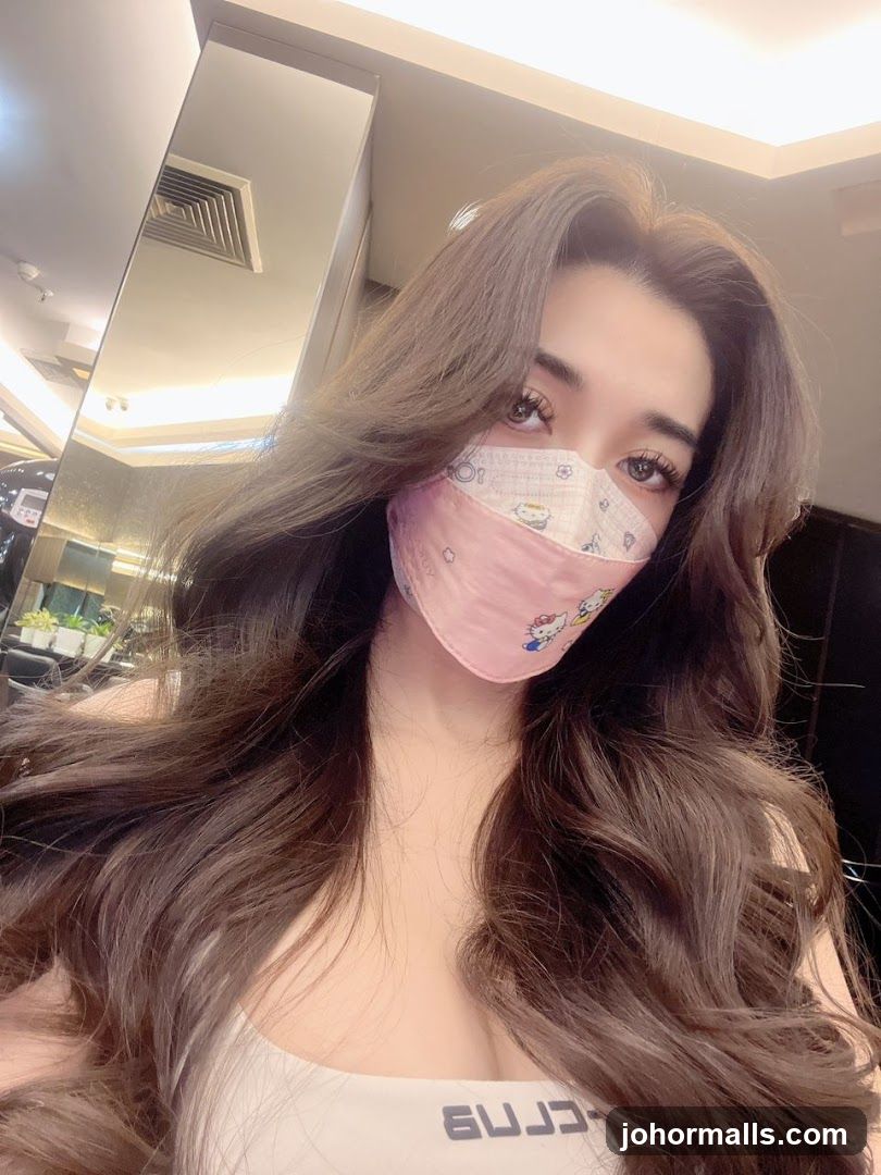 Woman wearing a Hello Kitty mask