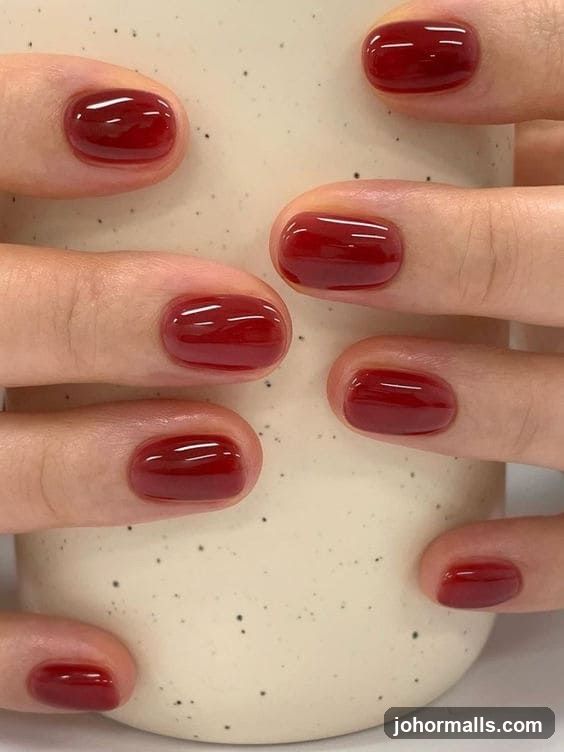 Hands with Red Nails Holding a Mug