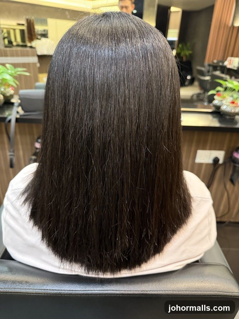 Woman's freshly cut dark hair