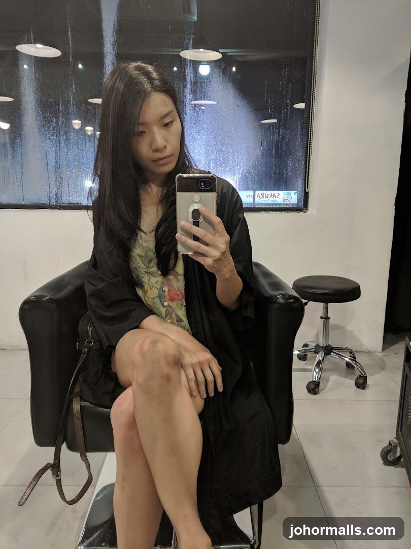 Woman taking a selfie in a salon