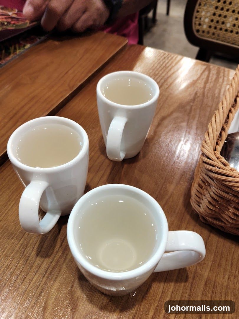 Three cups of tea on a wooden table