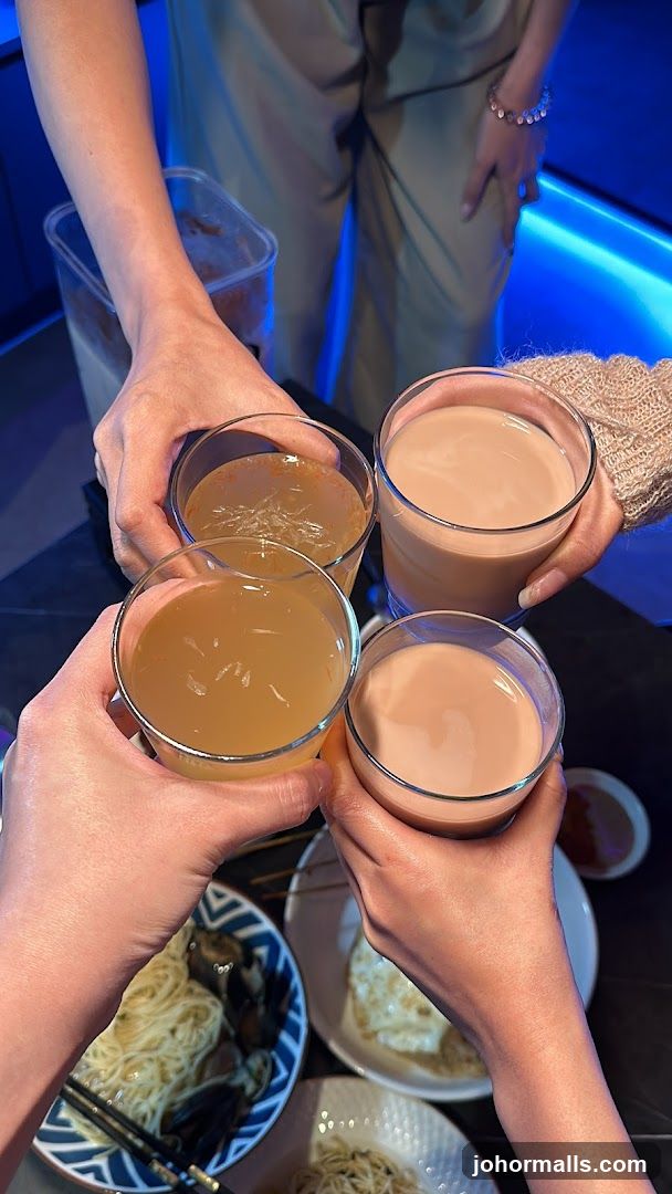 Friends toasting with drinks and food