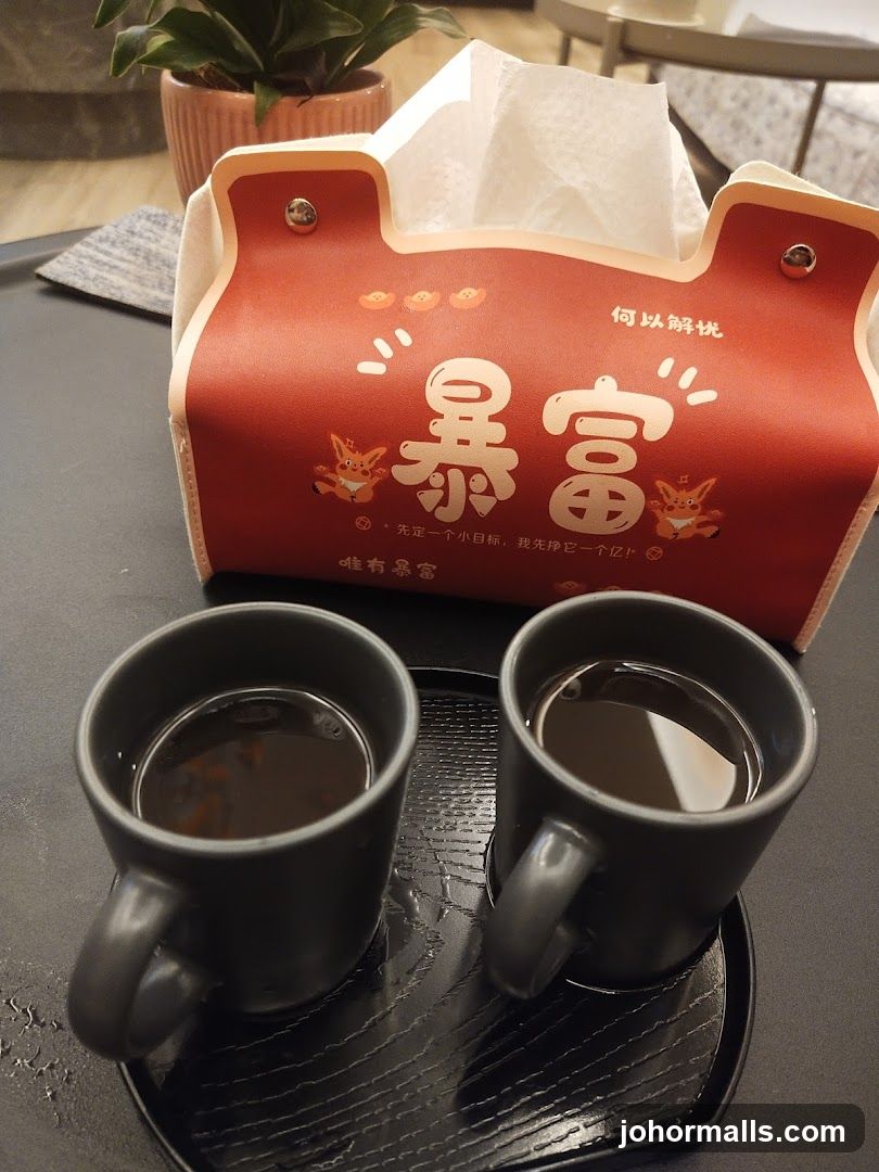 Two Cups of Coffee and a Tissue Box