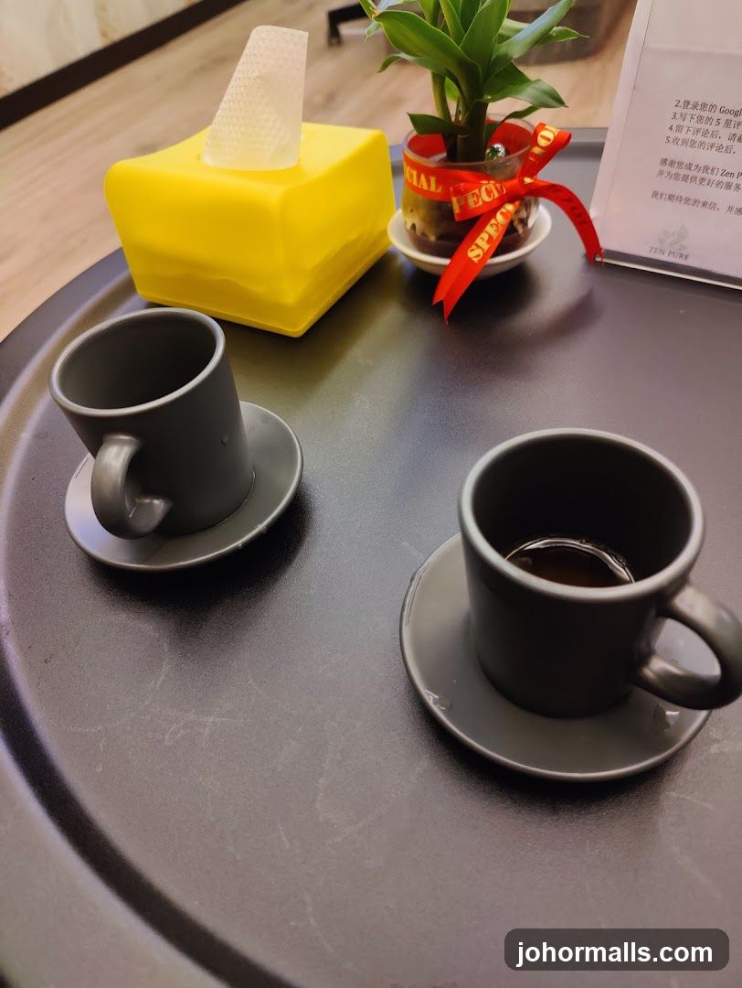 Two cups of coffee and a tissue box