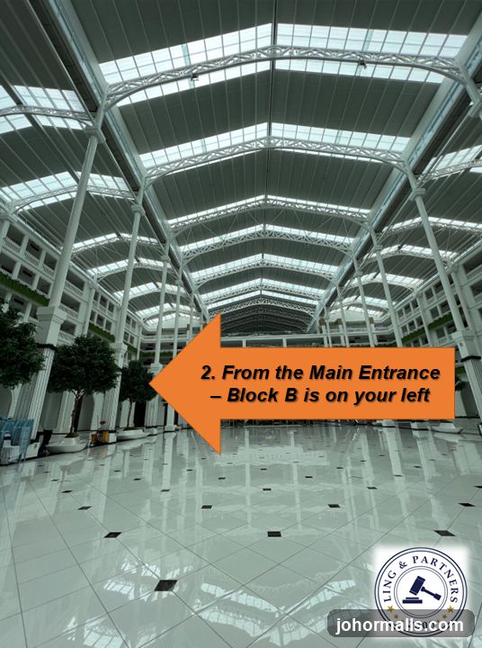 Interior of a large building with directional signage