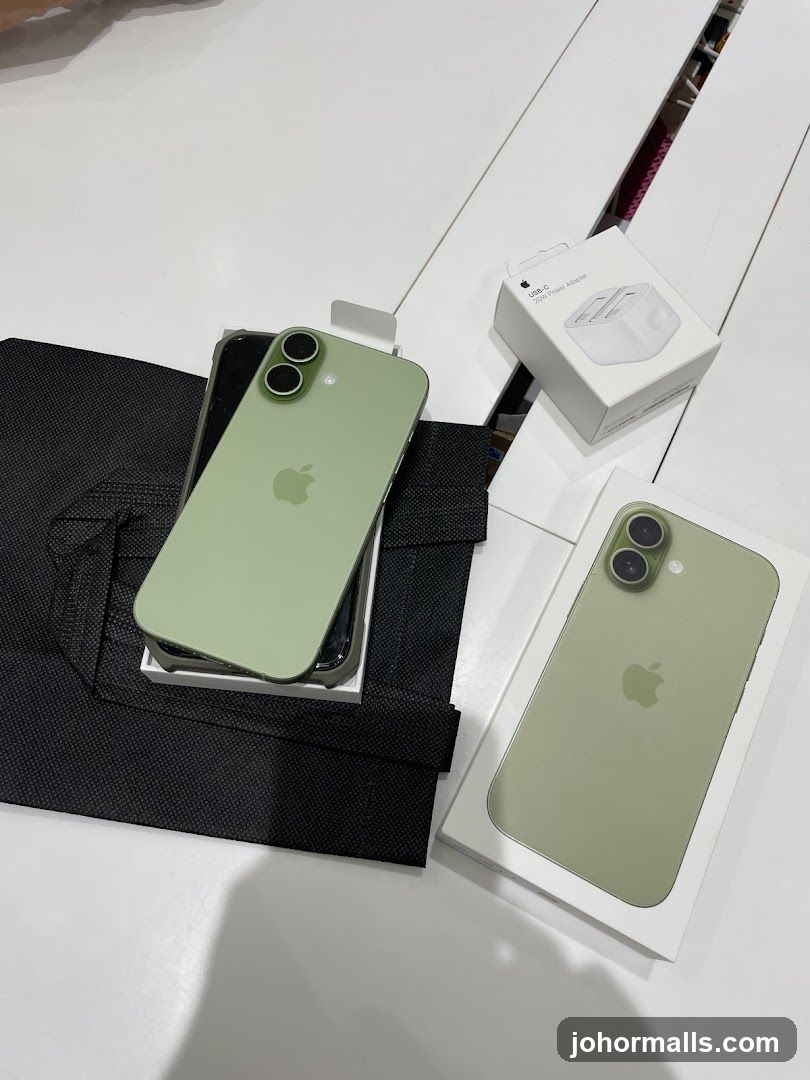 Two iPhones and a power adapter