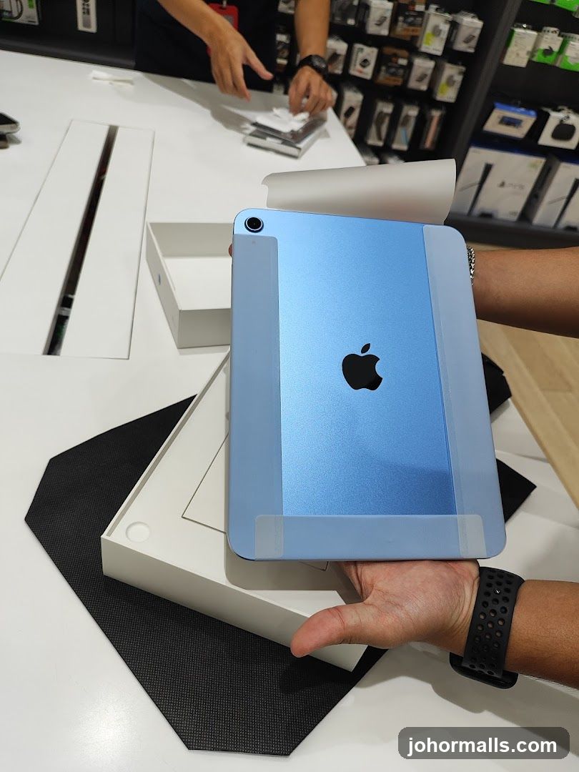 Unboxing a blue iPad