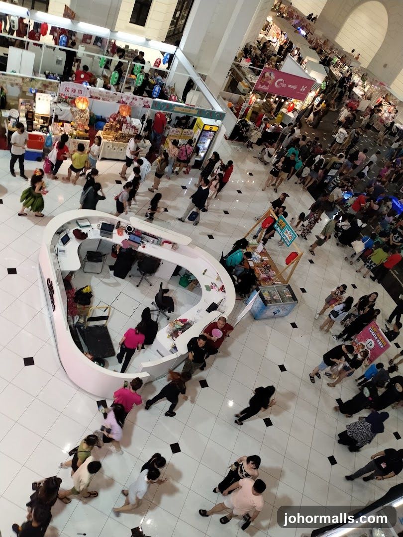 Crowded indoor market with various stalls