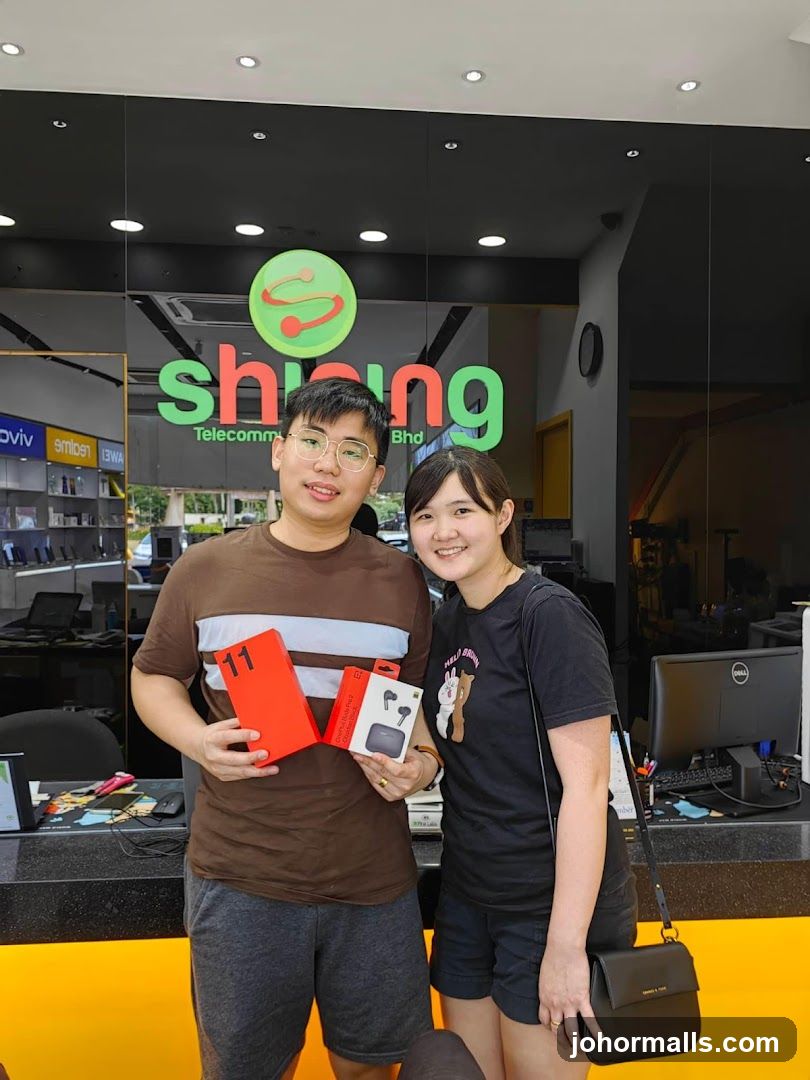 Two people holding electronics boxes