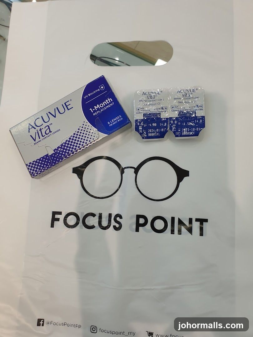 Focus Point branded shopping bag with contact lenses