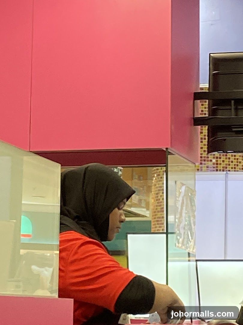 Woman in Hijab at Counter