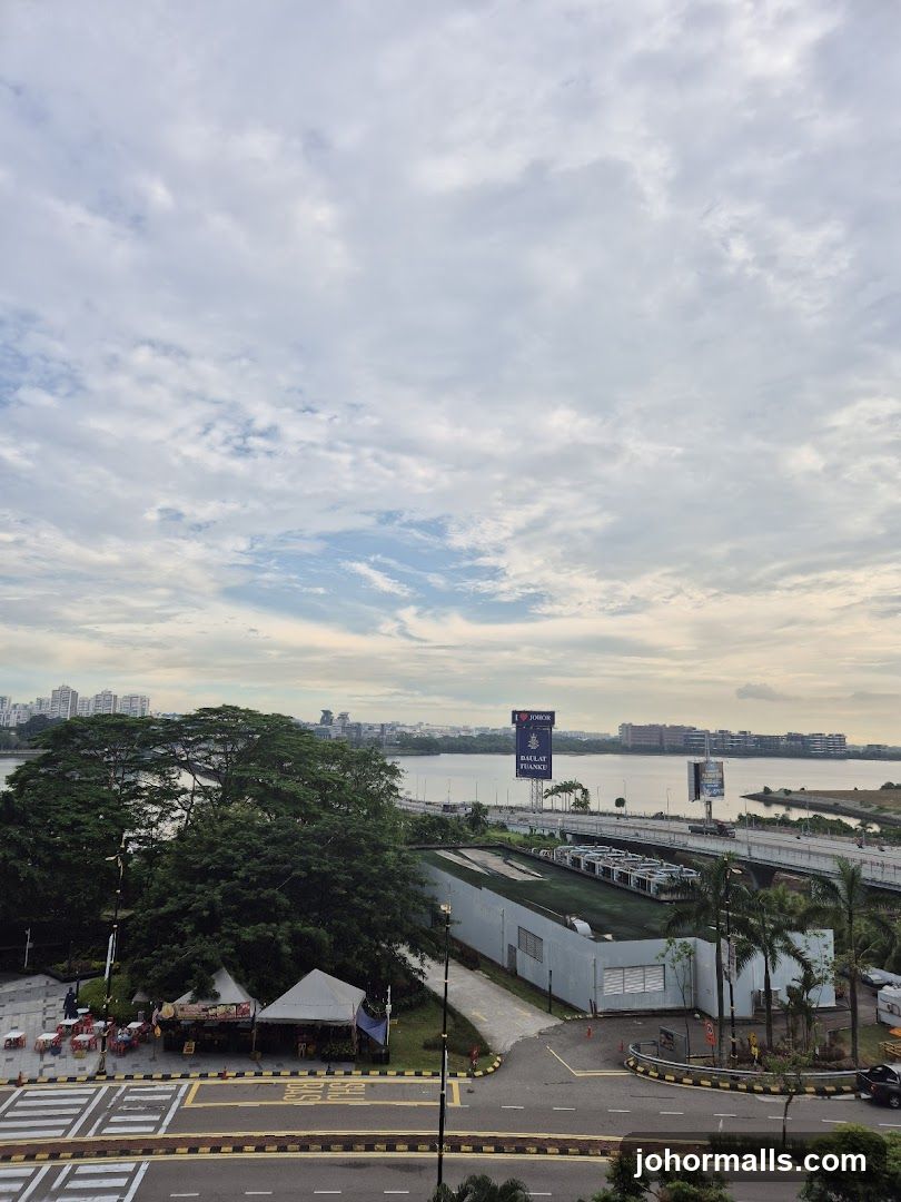 Outdoor scene with tents and a distant cityscape