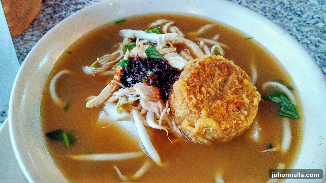 Bowl of Noodles with Chicken and Fried Patty
